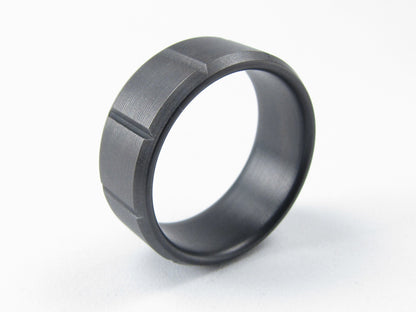 Black titanium mens ring with machined grooves