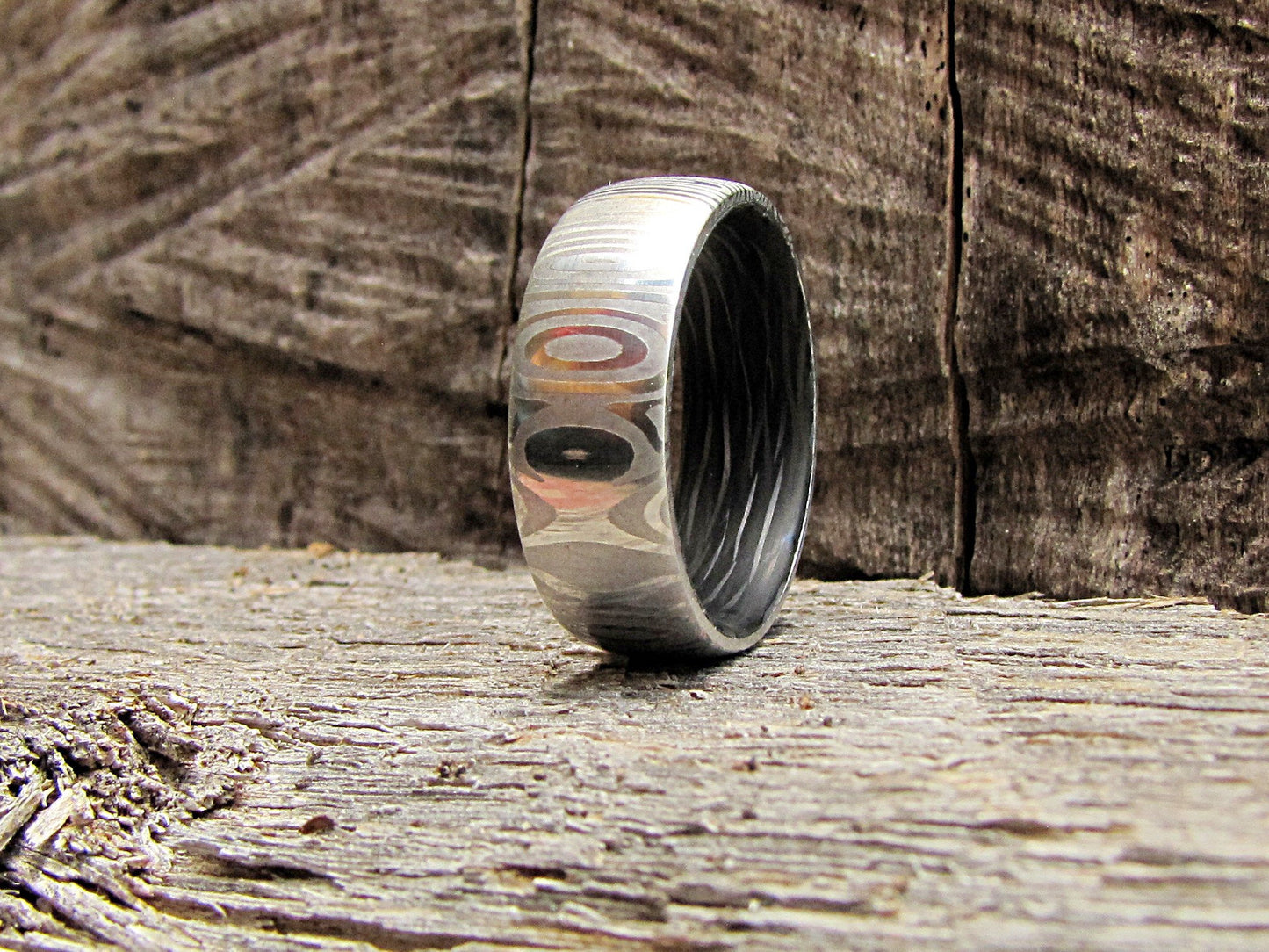 Damascus steel and carbon fiber mens wedding band